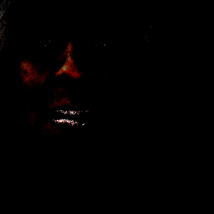 black man smiling in the dark
